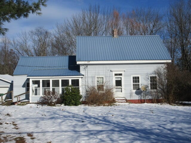 view of snow covered house