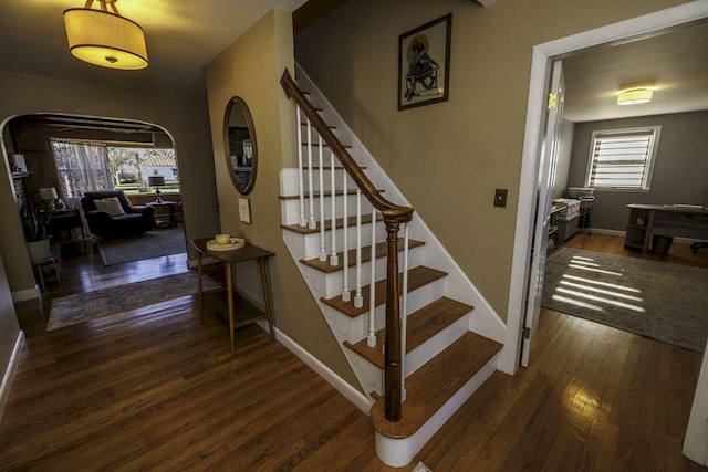 stairs with wood-type flooring