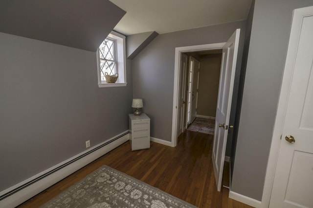 bonus room featuring baseboard heating and dark hardwood / wood-style floors