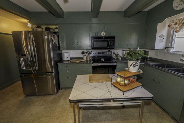 kitchen with sink, beamed ceiling, and appliances with stainless steel finishes