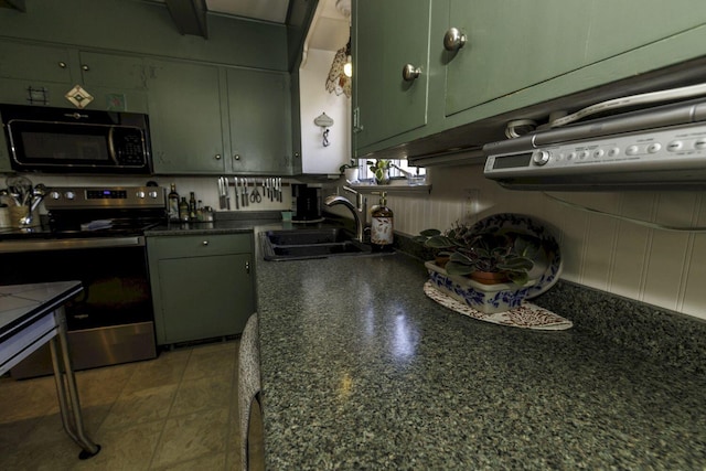 kitchen featuring green cabinets, electric stove, and sink