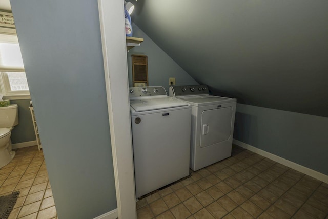 laundry room featuring independent washer and dryer and light tile patterned floors