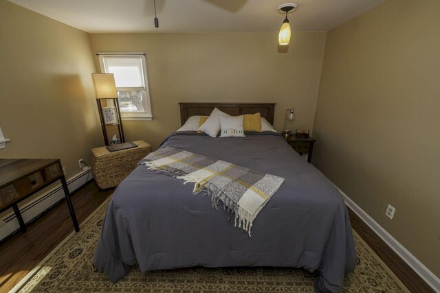 bedroom with ceiling fan and hardwood / wood-style floors