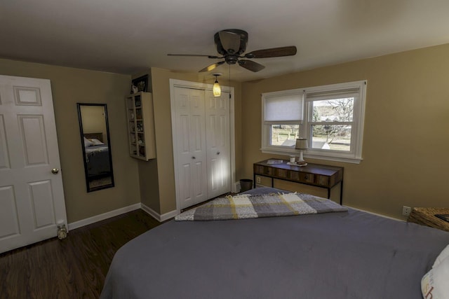 bedroom with ceiling fan, dark hardwood / wood-style floors, and a closet