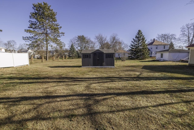 view of yard with a storage unit