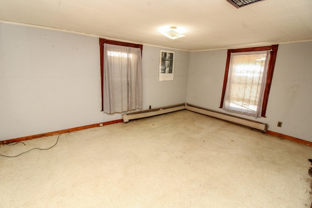 unfurnished room with carpet floors and a baseboard radiator