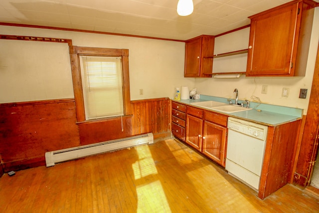 kitchen featuring white dishwasher, crown molding, sink, light wood-type flooring, and a baseboard radiator