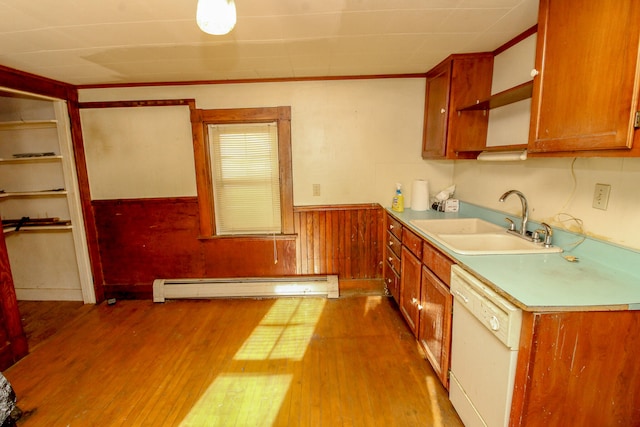 kitchen featuring white dishwasher, crown molding, a baseboard heating unit, sink, and hardwood / wood-style floors