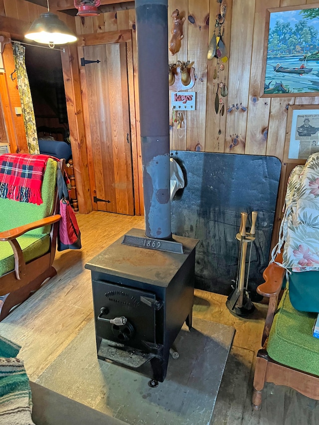 playroom with hardwood / wood-style floors and wood walls