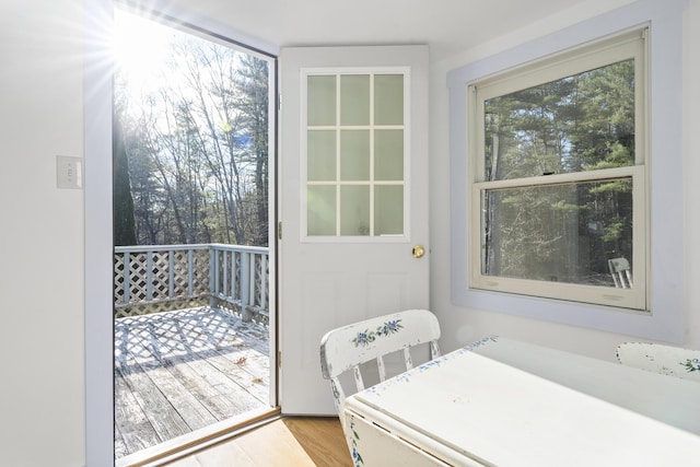 doorway to outside with light wood-type flooring