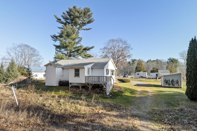 exterior space featuring a yard and a deck