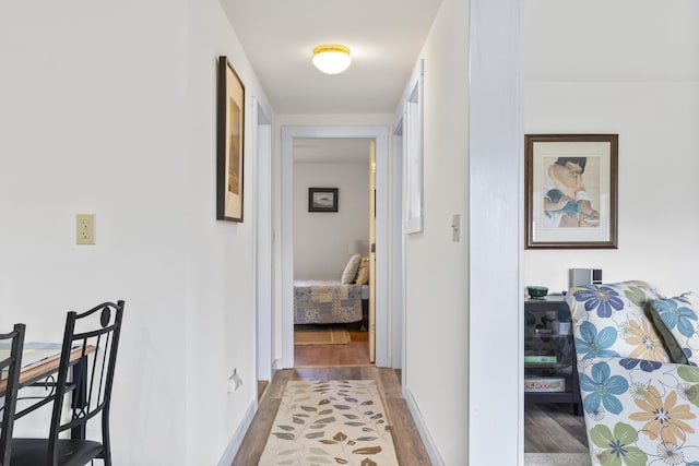 hallway featuring dark hardwood / wood-style flooring