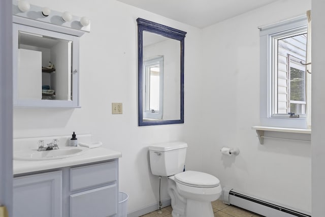 bathroom with tile patterned floors, vanity, a baseboard radiator, and toilet