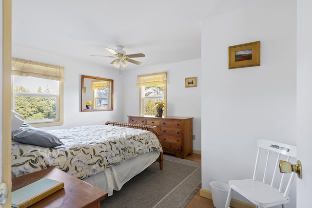 bedroom featuring ceiling fan and wood-type flooring