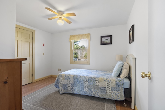 bedroom featuring ceiling fan and hardwood / wood-style flooring