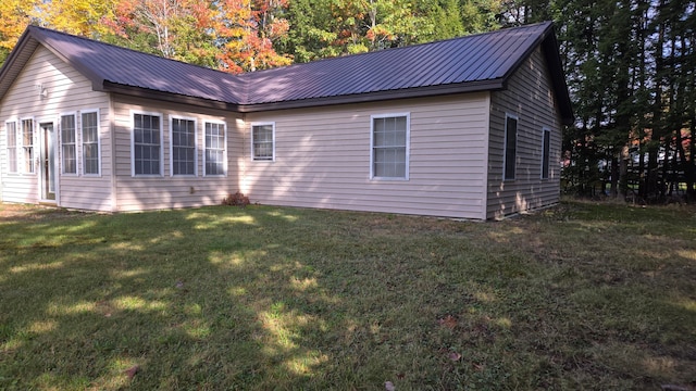 view of home's exterior with a yard