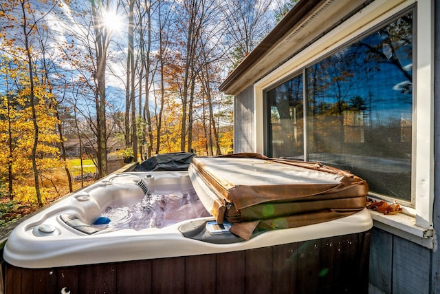 exterior space with a hot tub