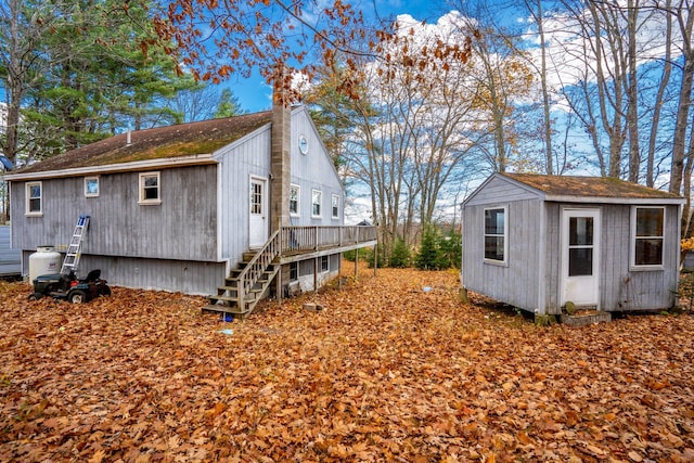 view of property exterior with a storage shed