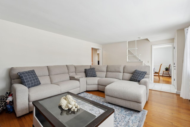 living room with a baseboard radiator and hardwood / wood-style floors