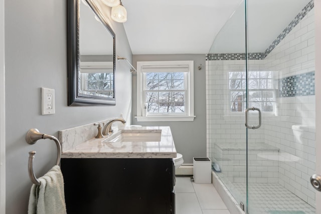 bathroom featuring tile patterned flooring, vanity, a shower with door, and lofted ceiling