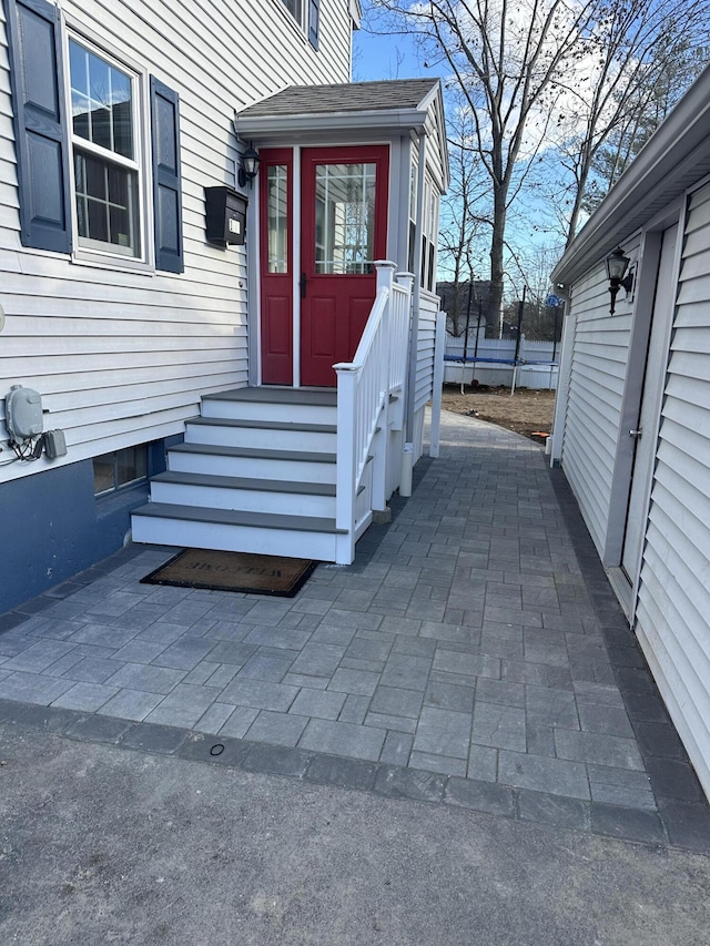 property entrance featuring a patio