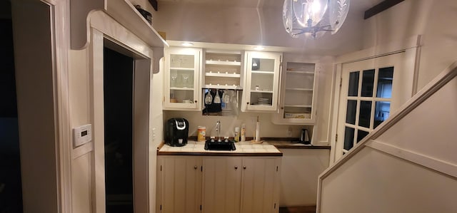 28 Maine Ave, Millinocket, ME 04462 - indoor wet bar featuring a chandelier
