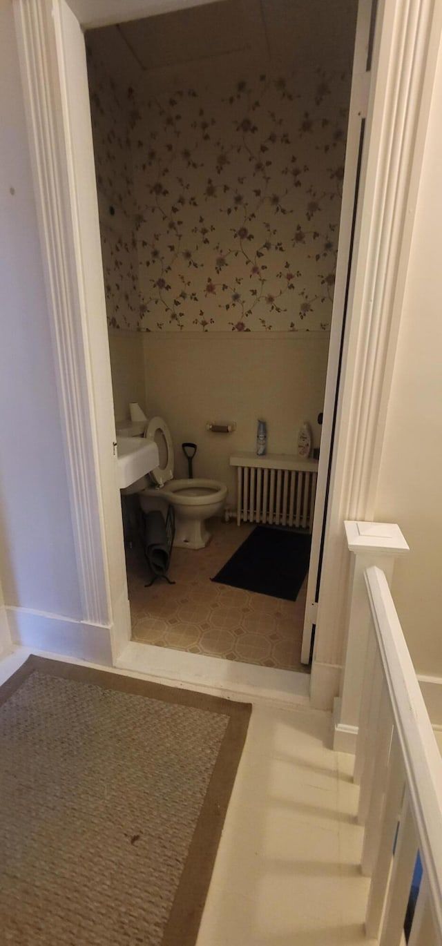 28 Maine Ave, Millinocket, ME 04462 - bathroom with toilet and radiator heating unit
