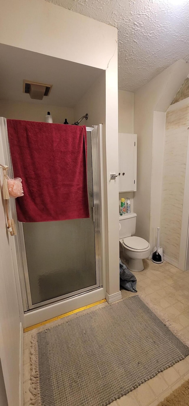 28 Maine Ave, Millinocket, ME 04462 - full bathroom with a stall shower and a textured ceiling