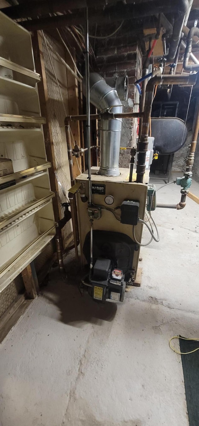 28 Maine Ave, Millinocket, ME 04462 - utilities with a heating unit