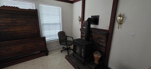 28 Maine Ave, Millinocket, ME 04462 - home office featuring a wood stove and light flooring