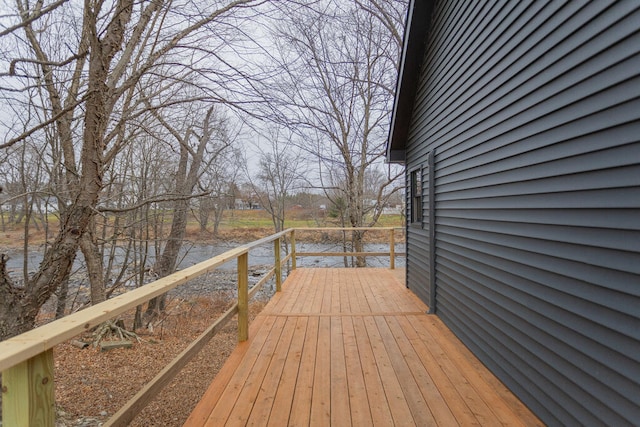 wooden terrace with a water view