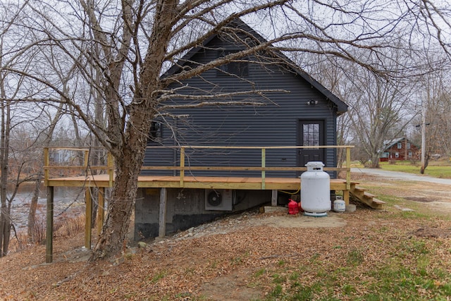 view of home's exterior with a wooden deck