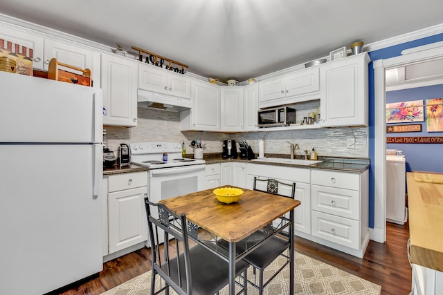 kitchen with white cabinets, dark hardwood / wood-style floors, white appliances, and sink