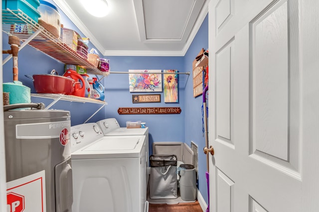 laundry room with electric water heater, ornamental molding, hardwood / wood-style flooring, and separate washer and dryer