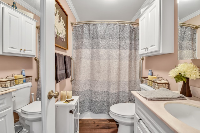 bathroom featuring curtained shower, crown molding, vanity, and toilet