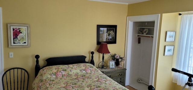 bedroom featuring hardwood / wood-style floors and crown molding