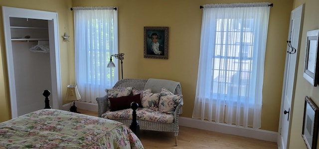 bedroom featuring light hardwood / wood-style flooring and a closet