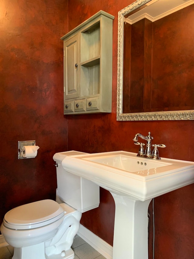 bathroom with tile patterned floors and toilet