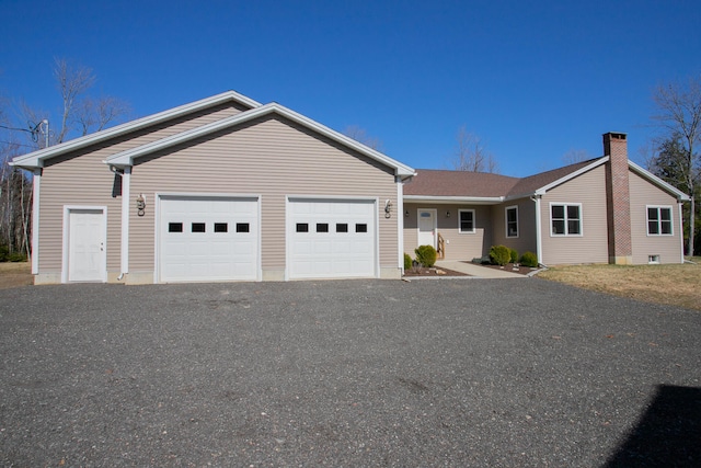 ranch-style home featuring a garage