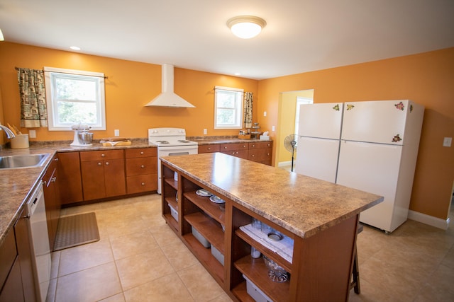 kitchen with a healthy amount of sunlight, sink, extractor fan, and white appliances