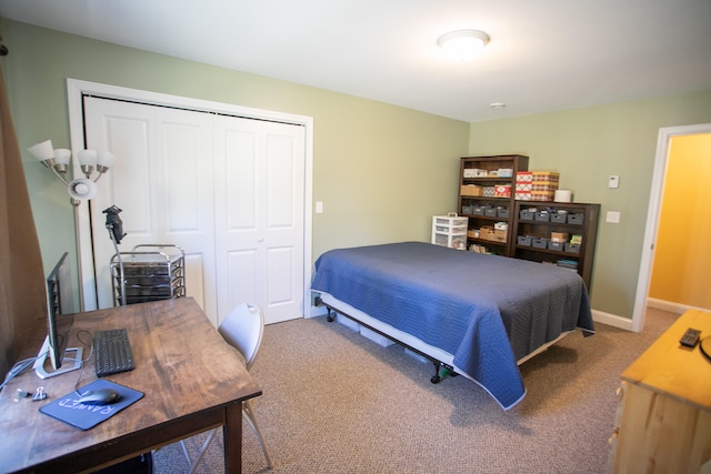 carpeted bedroom featuring a closet