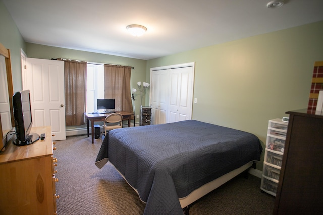 bedroom featuring carpet, baseboard heating, and a closet