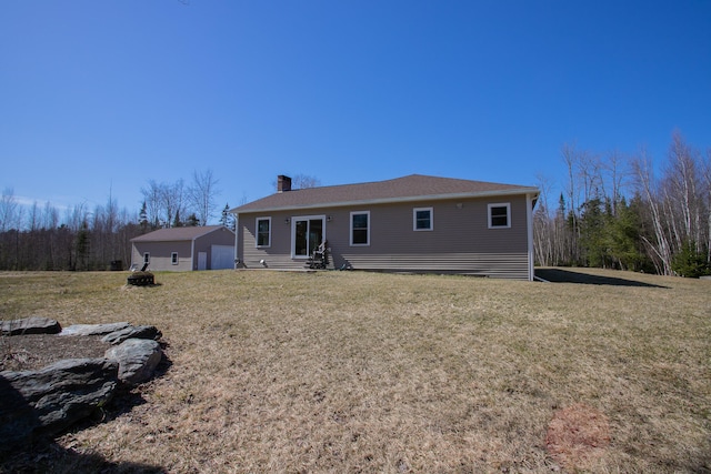 rear view of property with a yard