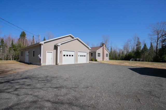 view of side of property with a garage