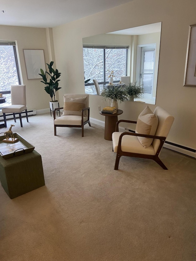 sitting room with a healthy amount of sunlight and light colored carpet