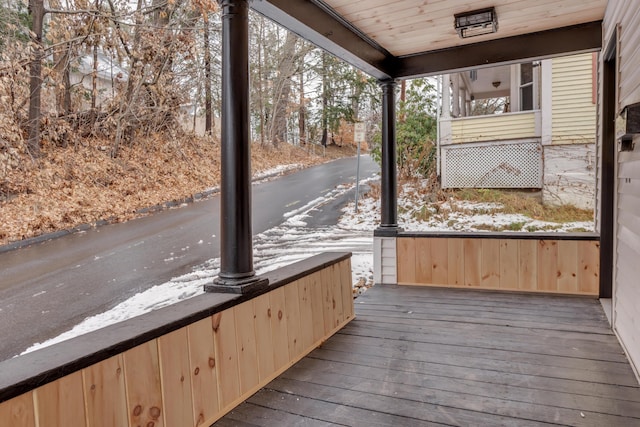 unfurnished sunroom with wood ceiling