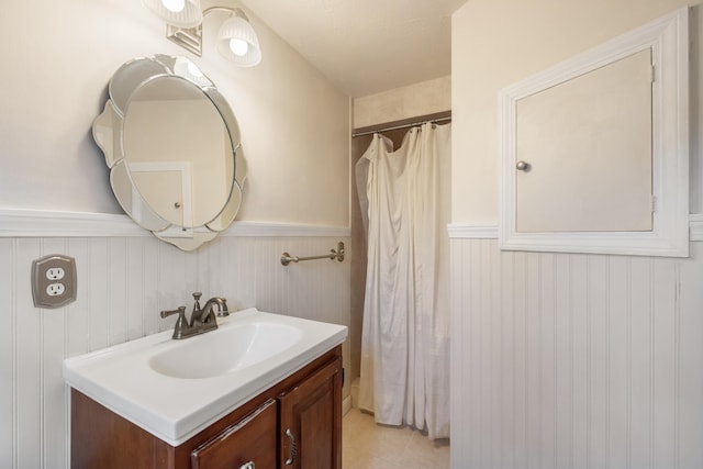 bathroom with tile patterned floors and vanity