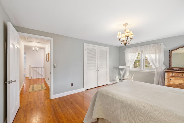 bedroom with a closet and light hardwood / wood-style floors