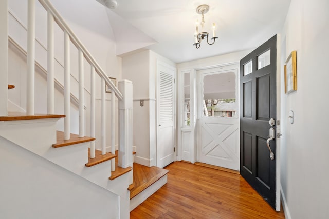 entrance foyer featuring a chandelier and hardwood / wood-style flooring