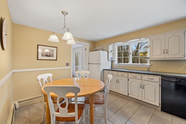 tiled dining space with baseboard heating